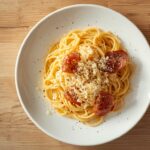 easy spaghetti carbonara recipe on white ceramic plate overhead shot