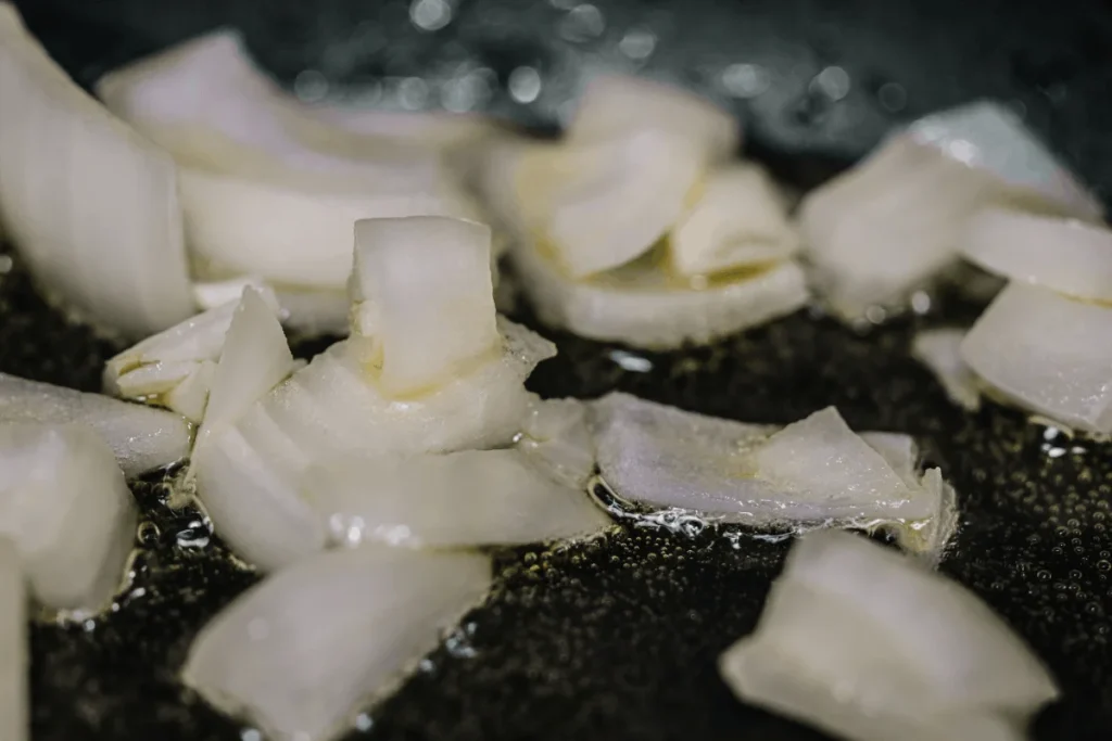 sauteing onions garlic olive oil.webp